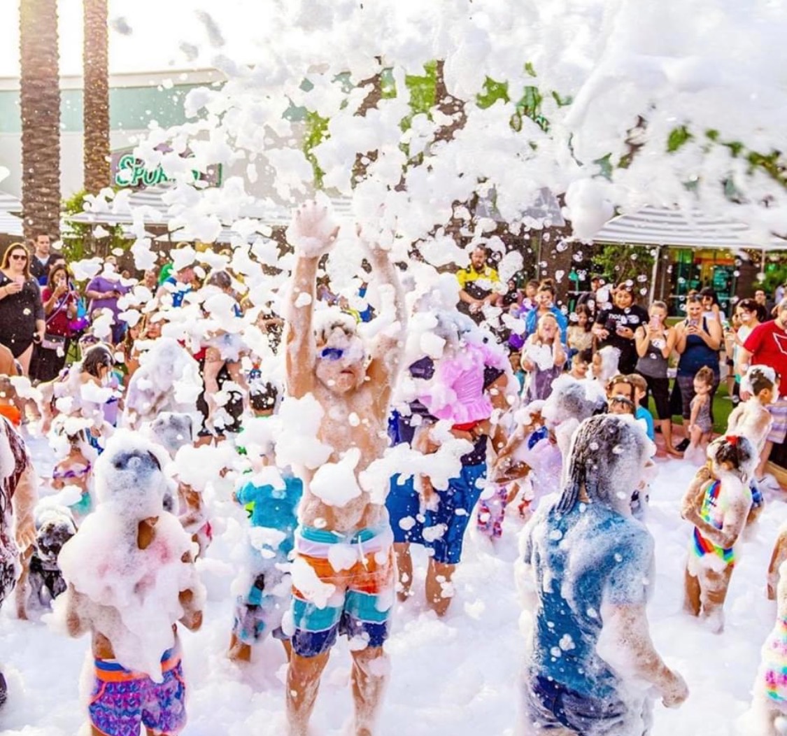 Community foam party at an outdoor festival